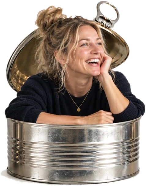 Sophie Evans, Projects & Client Lead, emerging from an open tin